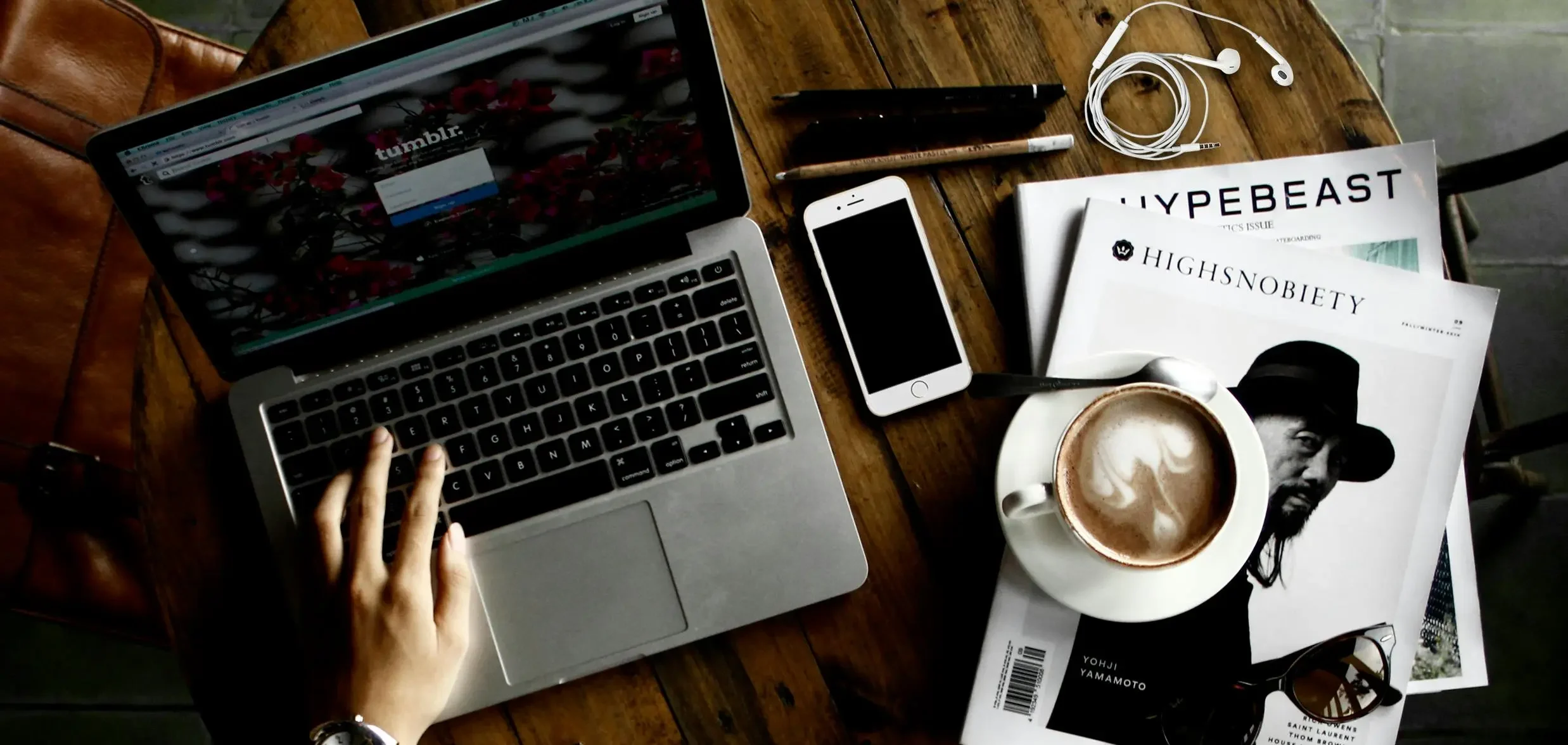 web design company Vancouver creative workspace laptop and design sketch